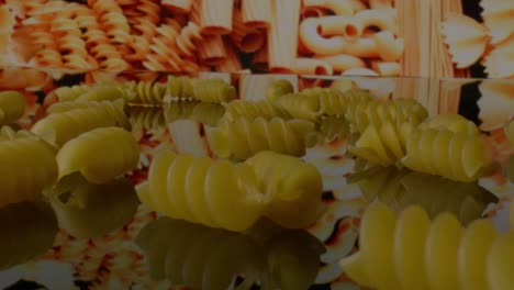 Macro-view-close-up-of-uncooked-rotini-pasta-with-camera-moving-forward