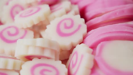 White-and-pink-Japanese-Kagosei-Narutomaki-fish-cakes,-push-in-closeup