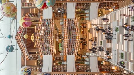 Vertical-Timelapse-Crowd-of-People-at-Starfield-Library-in-Suwon-Branch,-South-Korea