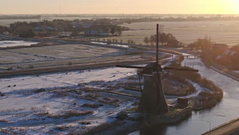 Windmill,-400-Years-Old,-Winter-Snow,-Haastrecht,-Netherlands,-Aerial-Establishing-Shot