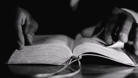 praying-to-god-with-bible-on-table-with-people-stock-video-stock-footage