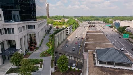 Luxury-Skyscraper-beside-busy-underpass-intersection-in-Atlanta-City