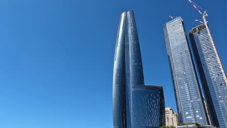 Tilt-down-view-of-Crown-Towers-Sydney-modern-building-design-on-clear-sunny-day