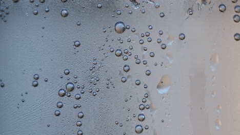 Close-up-view-revealing-sparkling-bubbles-rising-through-clear-water