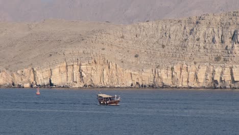 Old-wooden-ship-and-other-old-ships-in-the-harbor-of-Sur,-Khasab-of-Oman