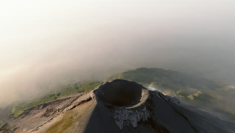 Slow-drone-orbit-shot-of-active-Fuego-volcano-crater-in-Guatemala-during-sunrise
