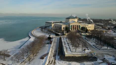 Aerial-drone-footage-of-Chicago-Adler-Planetarium-during-winter-time-with-below-zero-temperatures