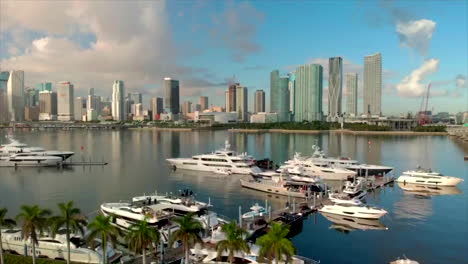 Aerial-drone-shot-of-Miami-skyline-in-the-morning-day-4k-with-many-yachts