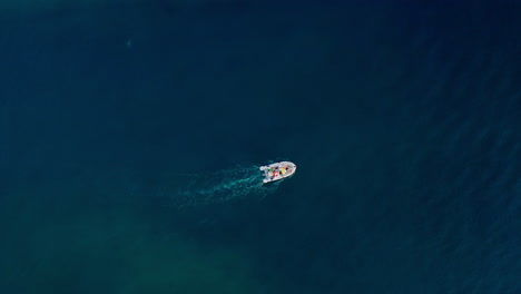 Top-down-aerial-view-of-a-boat-crossing-the-Adriatic-sea