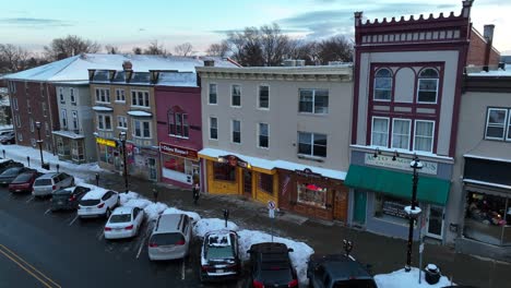 Pedestrian-walking-on-snowy-road-in-American-town