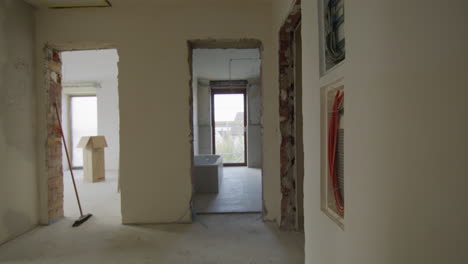 Tracking-shot-of-construction-site,-through-different-rooms