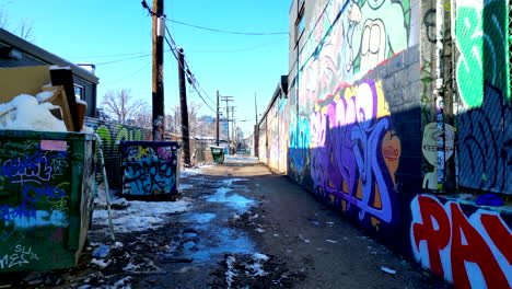 Graffiti-covered-alleyway-in-Denver's-RiNo-art-district-on-a-bright-sunny-winter-day