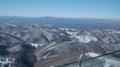 Tourist's-POV-Walking-View-from-Balwangsan-Mountain-Skywalk-Observation-Deck-on-Mountain-Ranges-in-Daegwallyeong-myeon,-Pyeongchang-gun,-Gangwon-do,-South-Korea