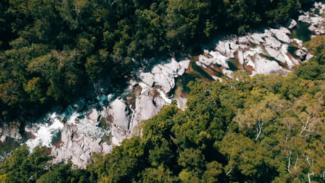 Cinematic-aerial-view-of-the-Behana-Gorge-river,-Holiday,-Remote,-Waterfall,-Cairns