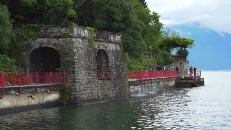 People-Walk-on-the-Stone-Path-near-the-Coast-of-Town-of-Varenna