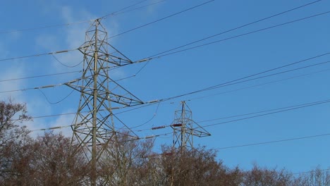 Electricity-pylons-against-a-blue-sky.-Winter.-UK