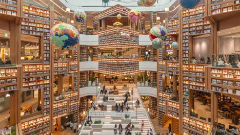 Time-Lapse-of-People-Visiting-Starfield-Suwon-Library-Hall-Decorated-with-Huge-Bookshelfs-and-Books