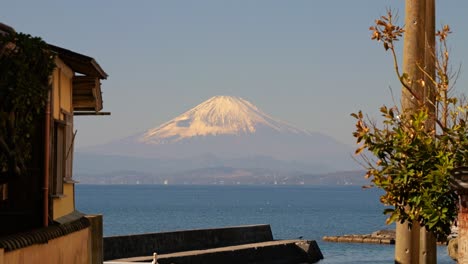 Famous-mount-Fuji-in-Japan-as-seen-from-a-narrow-alley-in-Hayama,-Kanagawa