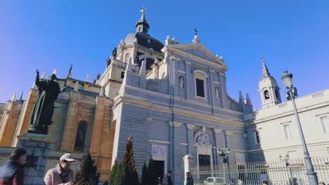 view-of-Catedral-De-La-Almudena-trough-gates,-a-large-church-in-Madrid