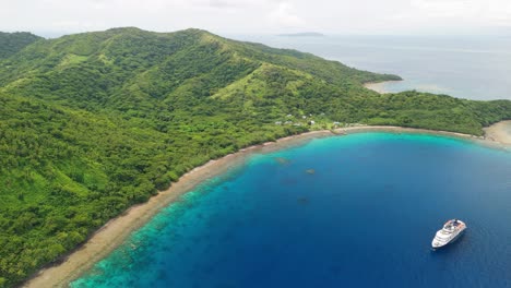 Cruise-ship-anchored-in-Fiji-off-small-remote-island