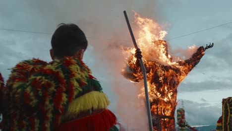 Caretos-Witness-the-Fiery-Demise-of-Carnival-Effigy,-Podence-Portugal