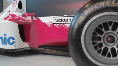 Formula-One-Race-Car,-dolly-shot-of-side-from-wheel-to-middle