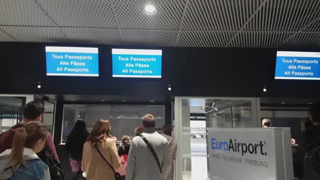 Passport-Control-Checkpoint-and-Passengers-on-Euroairport,-Basel-Mulhouse-Freiburg-Airport,-Switzerland-France-Border