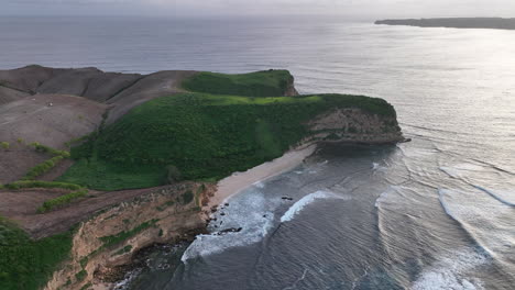 Views-over-the-headland-at-a-beach-on-Lombok-at-sunset,-Indonesia