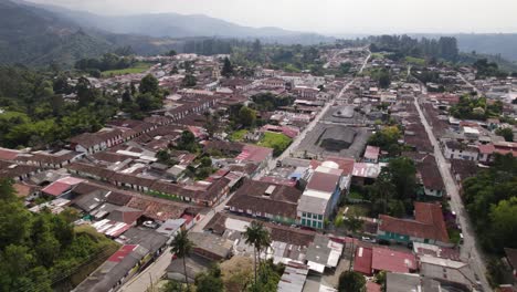 Aerial-view-overlooking-the-cityscape-of-sunny-Salento-city,-in-Quindío,-Colombia