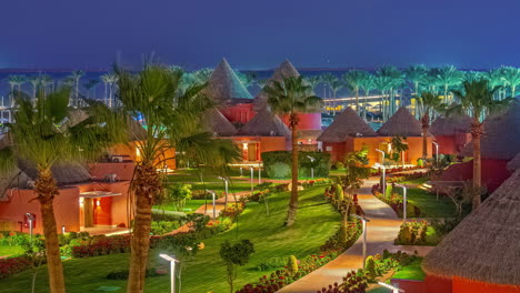 Timelapse-of-sunset-and-falling-night-over-a-luxury-resort-in-Egypt-between-palm-trees