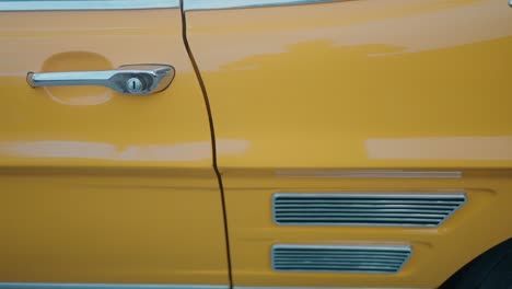 Detail-of-vintage-Yellow-Car-Door-and-Vent