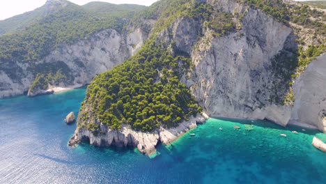 Oasi-beach-and-keri-caves-in-zakynthos,-greece-with-turquoise-waters,-aerial-view