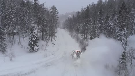 Tractor-Snowblower-Working-On-A-Countryside-Road-With-Winterly-Atmosphere