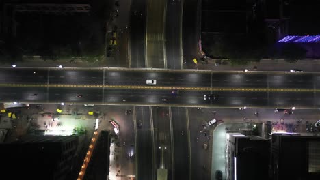 Rajkot-aerial-drone-view-Many-vehicles-are-going-to-the-phone-center-and-many-vehicles-are-parked-on-the-side-in-the-complex