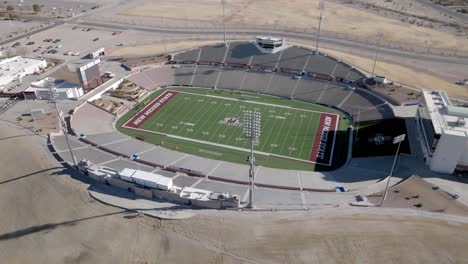 Aggie-Memorial-stadium-on-the-campus-of-New-Mexico-State-University-in-Las-Cruces,-New-Mexico-with-drone-video-pulling-back