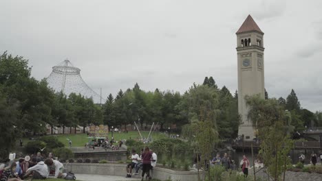 Hoopfest-2018---Pavilion-and-Clocktower-at-Riverfron-Park-in-Spokane,-WA,-site-of-Expo-'74,-crowd-walks-by