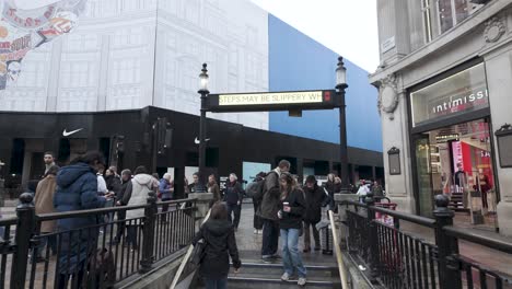 Pedestrian-commuter-entrance-staircase-to-Oxford-street-station-underground-tube-on-overcast-day