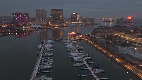 Baltimore-Inner-Harbour-ferry-terminal,-Patapsco-Riverside-waterfront-area-neighbourhoods-and-development-at-dusk,-Maryland,-USA