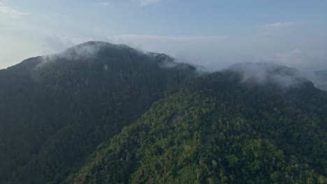 Drone-fly-over-greenery-landscape-of-rainforest-on-the-mountain-range