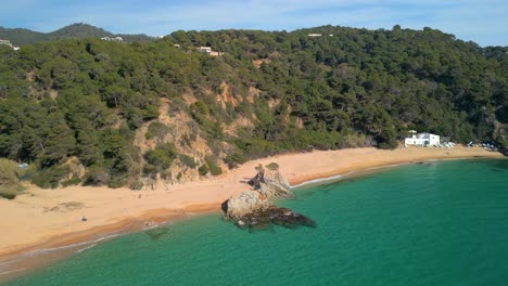 Discover-the-scenic-wonders-of-Lloret-De-Mar-and-the-idyllic-serenity-of-Cala-Canyelles,-nestled-within-the-picturesque-landscape-of-Costa-Brava