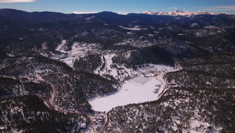 Evergreen-Colorado-aerial-drone-scenic-landscape-Mount-Evan-Bluesky-three-sisters-lake-house-golf-course-Jeffco-high-school-winter-morning-Denver-open-space-Etown-forward-pan-up-reveal-motion