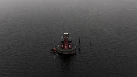 An-aerial-view-of-the-Stepping-Stones-Lighthouse,-built-in-a-Victorian-style-located-in-the-Long-Island-Sound,-NY