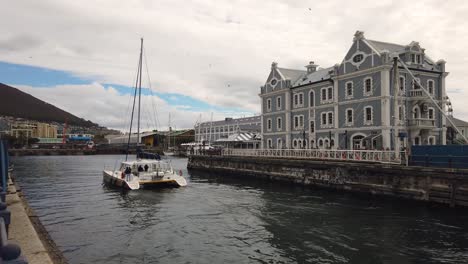 Catamaran-enters-port-in-Cape-Town,-South-Africa