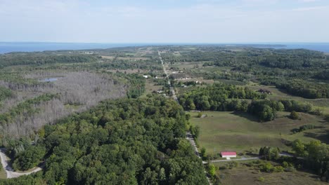 Countryside-landscape-of-Old-Mission-Peninsula-with-farms,-forests-and-vineyards,-aerial-drone-view