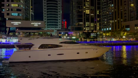 DUBAI,-UAE--04-January-2024:-Night-view-of-moored-yachts-and-skyscrapers-in-Dubai-Marina---a-residential-neighborhood-and-a-district-in-Dubai,-United-Arab-Emirates