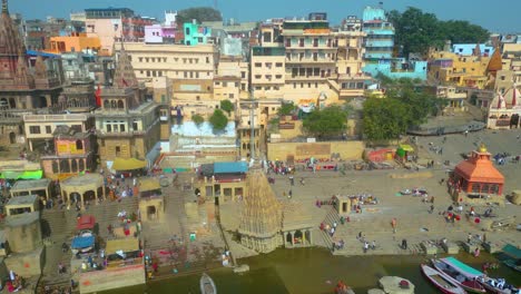 AERIAL-view-of-Dashashwamedh-Ghat,-Kashi-Vishwanath-Temple-and-Manikarnika-Ghat-Manikarnika-Mahashamshan-Ghat-Varanasi-India
