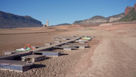 Old-buildings-emerging-from-empty-swamp-due-to-the-problems-of-extreme-dryness-and-lack-of-rain