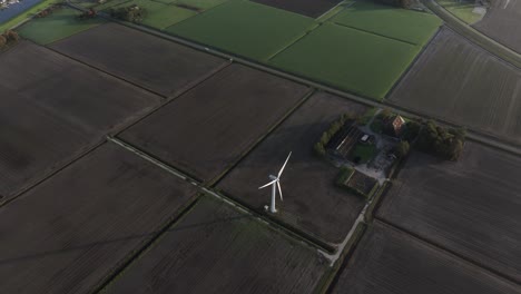 Aerial-view-of-farmland-and-fields-during-a-foggy-morning,-Workum,-Netherlands