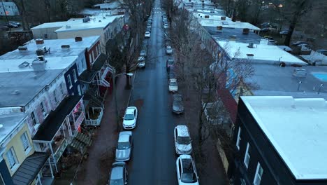 Parking-cars-in-straight-narrow-road-in-dense-American-population-at-dusk