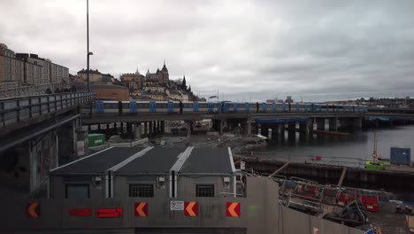 Subway-train-passes-through-Slussen-in-Stockholm-on-bridge